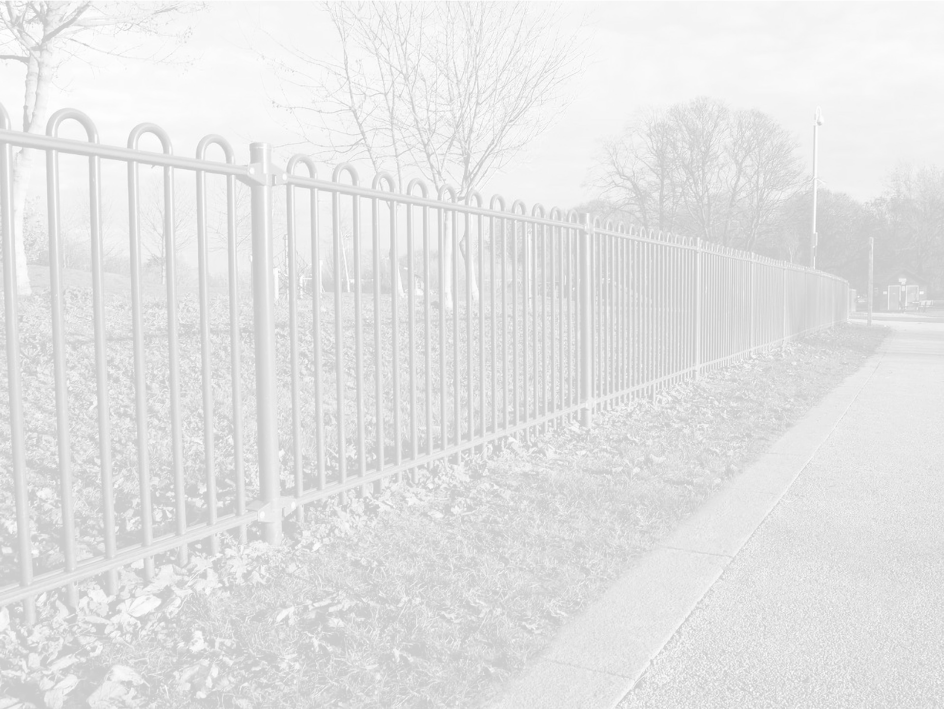 A tall white security fence